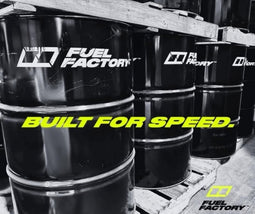 Fuel Factory race fuel drums stacked in warehouse built for speed high performance drag racing fuel supply