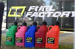 Fuel Factory race fuel jugs in multiple colors used for drag racing fuel handling and trackside performance fueling