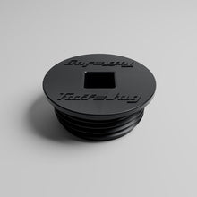 Angled view of TUFF JUG black threaded storage cap for Auto Stop fuel spout compatibility