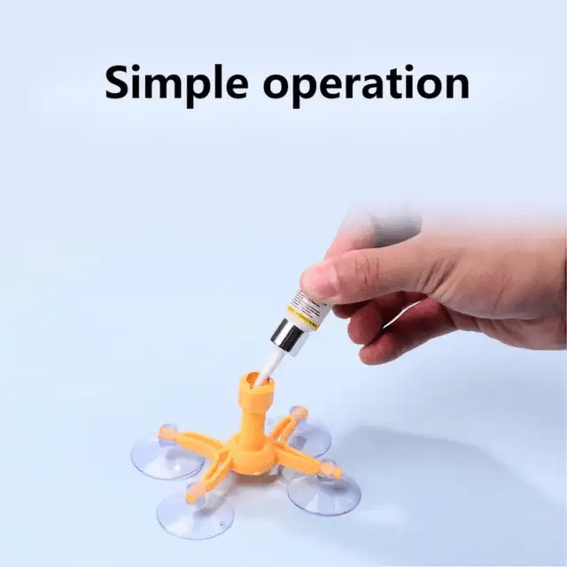 hand holding windshield repair tool demonstrating simple DIY chip repair application