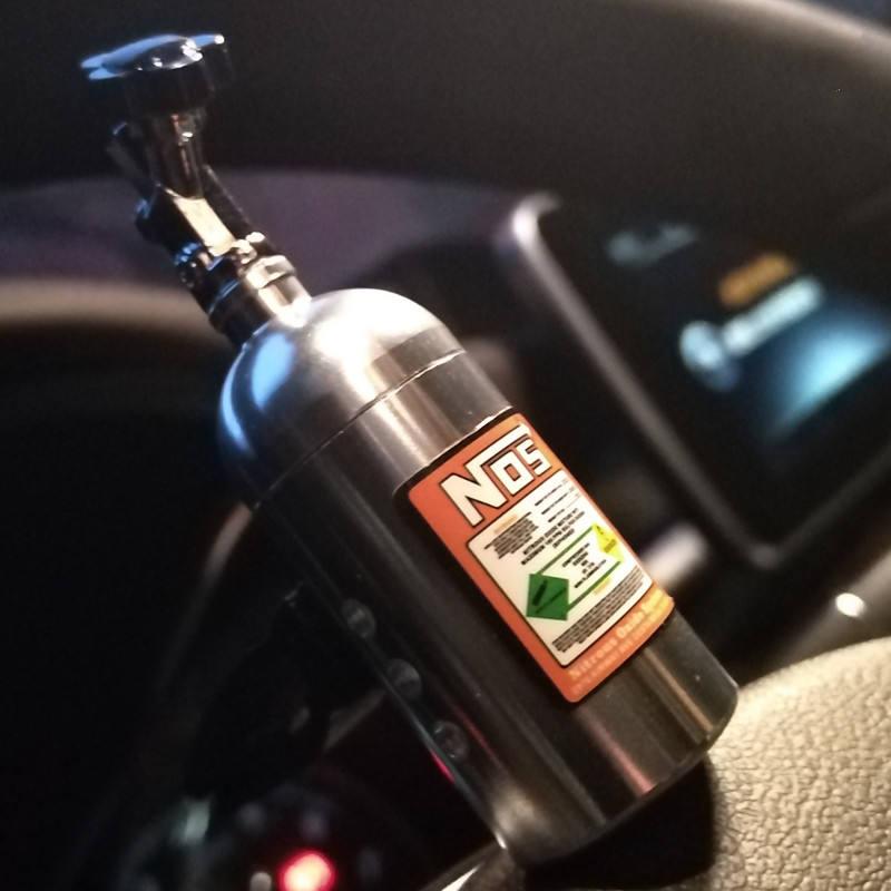close up of silver NOS nitrous bottle air freshener inside car